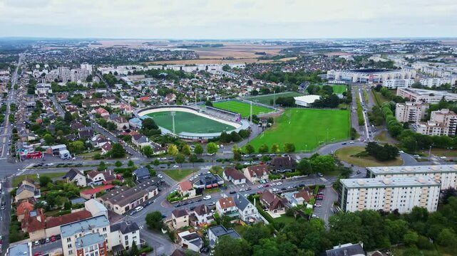 Venois Stadium and Malherbe Stadium, Caen, France. Aerial drone tilt down backward