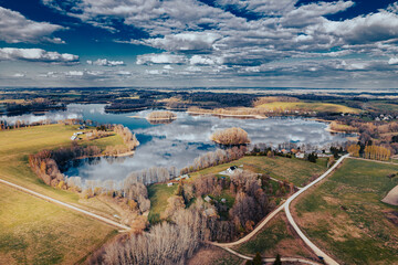 aerial view of a forest and big lake in Europe in autumn
