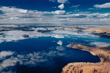 aerial view of a forest and big lake in Europe in autumn