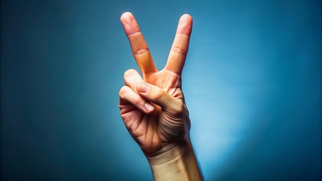 In a bold and defiant gesture, I raise my hand to the sky, my index and middle fingers