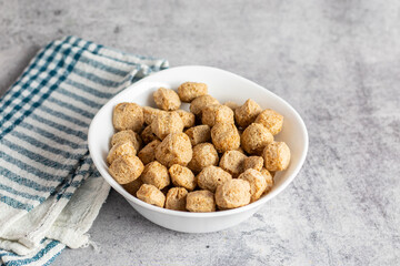 Raw soya chunks are dehydrated, protein-rich, plant-based meat substitutes made from defatted soy flour, commonly used in vegetarian dishes.