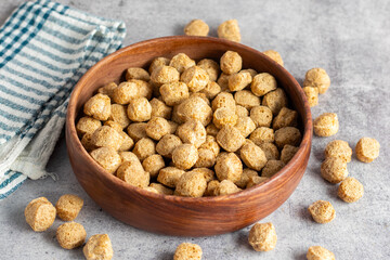 Raw soya chunks are dehydrated, protein-rich, plant-based meat substitutes made from defatted soy flour, commonly used in vegetarian dishes.