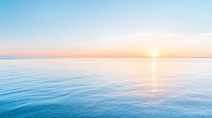 Obraz premium Sunrise over a calm ocean, symbolizing new beginnings and fresh starts