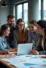 a group of people are looking at a laptop