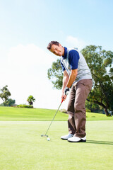 Sports, golf course and man with equipment for playing, training and practice for tournament game. Country club, male person or happy golfer with skills for championship match, coordination and stick