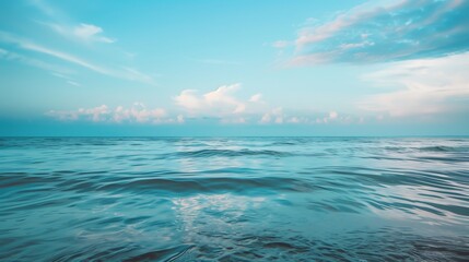 Obraz premium Tranquil Ocean Waves and Serene Sky with Early Morning Light â€“ Perfect Landscape Photography for Relaxation and Nature Inspiration.