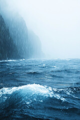Naklejka premium Rain on the Ocean waves for vertical background
