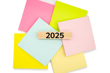 2025 text wooden block on colorful sticky note. 2025 new year idea concept.