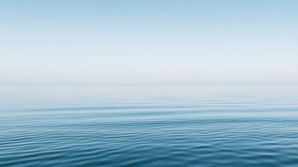 Obraz premium The calm surface of the sea stretching endlessly to the horizon, reflecting the serene sky. A tranquil and expansive ocean view that captures the vastness and beauty of nature, perfect for peaceful an