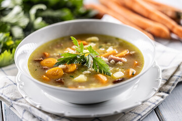 Soup made from barley groats, smoked pork neck, potatoes and root vegetables