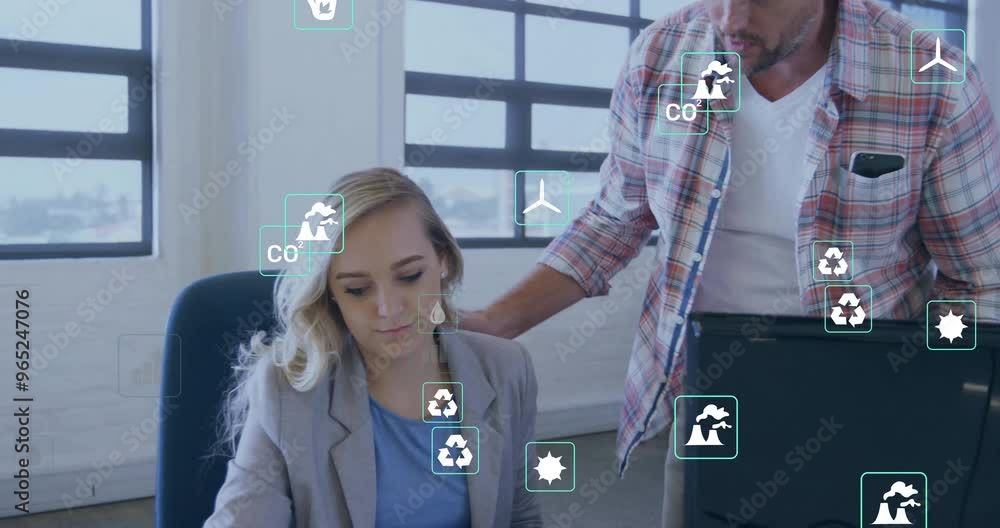 Aufkleber animation of ecology icons over caucasian colleagues using computer in office