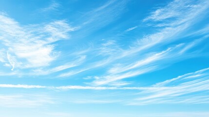 Serene blue sky with wispy cirrus clouds