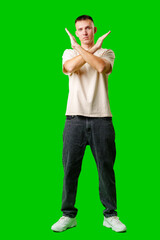 Man Gesturing No Signal Against Bright Green Background studio shot