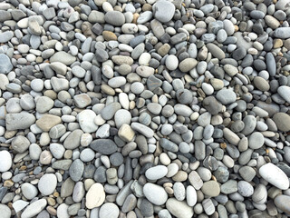Stone pebbles as an abstract background. Texture