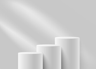 Cylindrical white matte podiums. Background with rays of light to demonstrate the product.