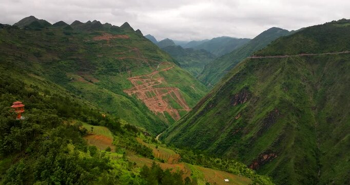 China-Vietnam border dangerous winding roads with mountain passes, Aerial pullback