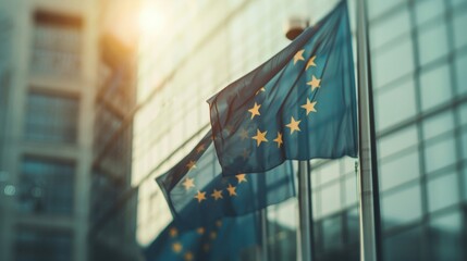 The European Union flags flutter prominently outside a contemporary building as the sunset casts a warm light