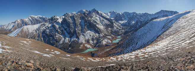 Mountain valley with lakes, view from above, snow and rocky slopes, panoramic view © Valerii
