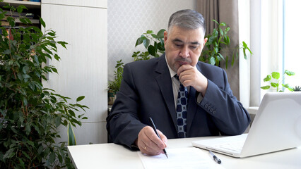 Businessman at His Desk: Office Work Concept