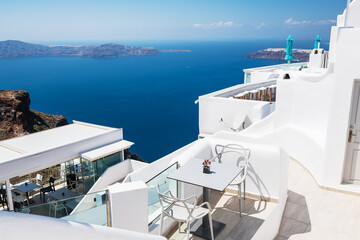 White architecture in Santorini island, Greece. Beautiful terrace with sea view at sunny day.