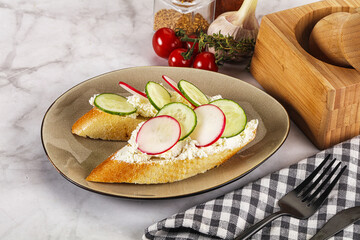 Bruschetta with soft cheese and radishes