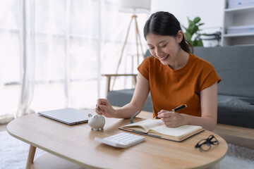 woman financial saving plan in a notebook, organizing her goals and budgeting strategies to achieve long-term financial stability and success