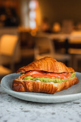 Savoury croissant with salmon, avocado guacamole and cream cheese