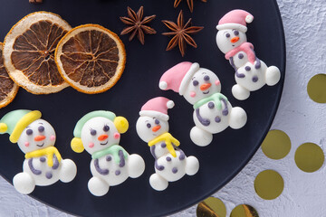 Christmas marshmallows. Winter candy. Sweet food in december. Snowman and Santa Claus