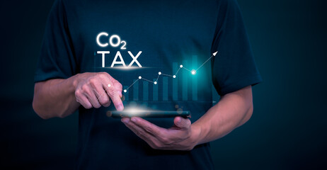Ideas for reducing carbon emissions Businessman showing carbon tax collection graph and...