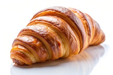 Fototapeta premium One croissant closeup on a white background with leading lines, meal, baked, delicious, breakfast, isolated, closeup, flaky, indulgence, bakery, appetizing, isolated, baked goods, fresh