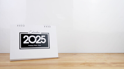 Calendar year 2025 schedule on wood table white background.
2025 calendar planning appointment meeting concept. copy space.