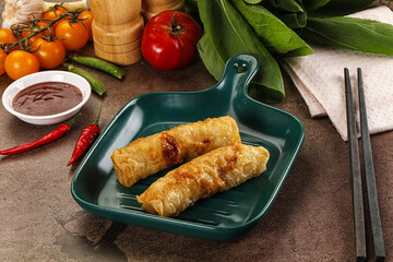Vietnamese stuffed spring roll served sauce