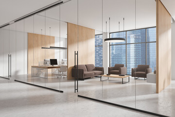 Modern office interior with glass coworking space and lounge zone with window