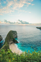 Majestic view during the sunset in Kelingking Beach, in island of Nusa Penida, Indonesia. summer background and summer holiday concept. © Balnyes Visuals