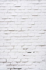 Naklejka premium Texture of white painted brick wall with rough surface and natural imperfections 