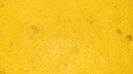 Fototapeta premium Dirty yellow cement wall background. yellow cement texture that is smeared. Backdrop yellow cement wall texture design