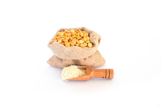 yellow seeds called Vicia Faba or Broad Beans like lupine on sale at the market. This legume can cause serious allergy to those predisposed, Yellow split peas in a bowl on a white background.