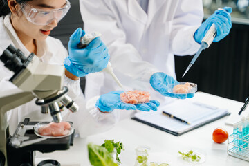 Fototapeta premium Food scientists in lab coats, testing samples, and analyzing food safety and quality in a laboratory
