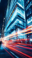 Obraz premium Urban Night Scene with Glass Facade and Light Trails