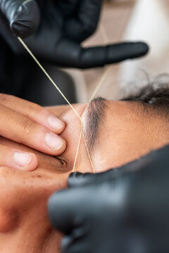 Close-up of Eyebrow Threading for Man