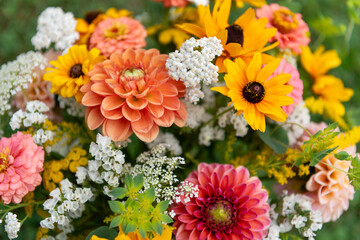 Summer bouquet. Beautiful orange, yellow and white fresh flower arrangement. Birthday or weddding bouquet made of summer flowers close up.