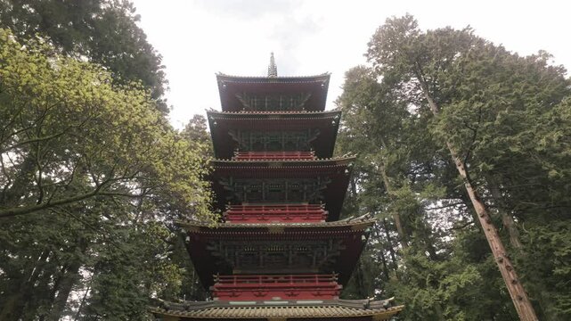 Slow pan upwards at a main pagoda at Nikko