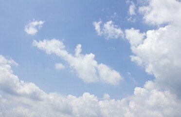 
Blue sky with puffy clouds