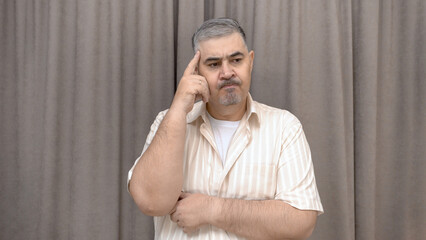 A man deep in thought. Reflections, decision making, doubts.