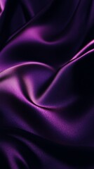 Purple silk fabric with smooth folds, textured backdrop. Luxury textile and elegance concept