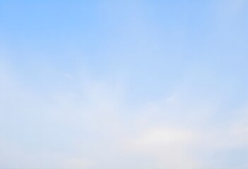 Obraz premium Clear blue sky with a single, fluffy white cloud drifting across it