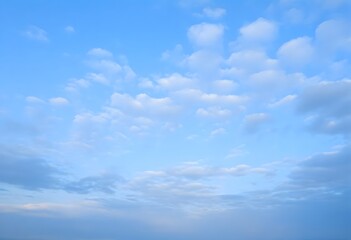 Fototapeta premium Clear blue sky with a single, fluffy white cloud drifting across it
