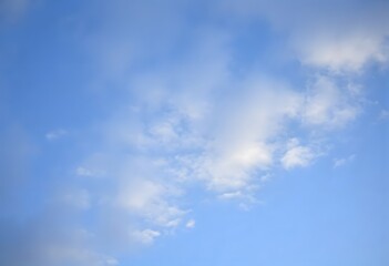 Summer day with a bright blue sky and scattered white clouds