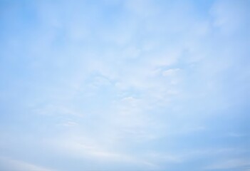 Fototapeta premium Summer day with a bright blue sky and scattered white clouds
