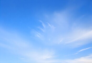 Fototapeta premium Summer day with a bright blue sky and scattered white clouds